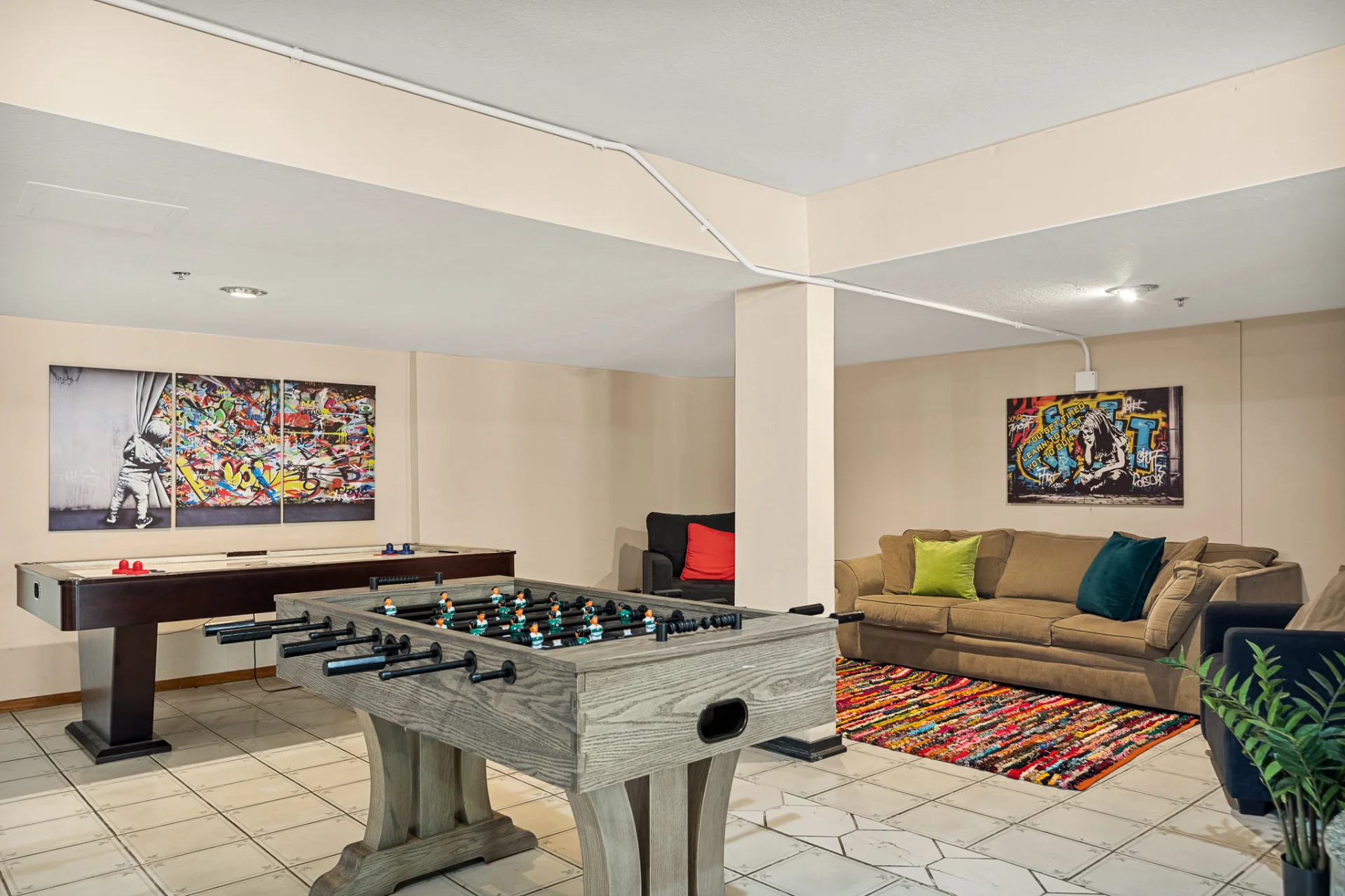 game room lounge area, foosball table, and air hockey